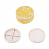 rundt blomstret gult smykkeskrin