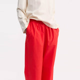 Røde bomuldsbukser fra Skall Studio i Hausfrau